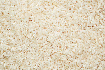 Polished long-grain rice, texture in close-up.