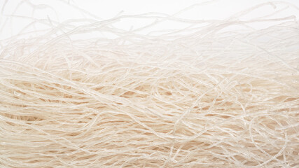 Asian thin rice noodles in close-up.