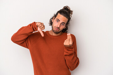 Young caucasian man isolated on gray background showing that she has no money.
