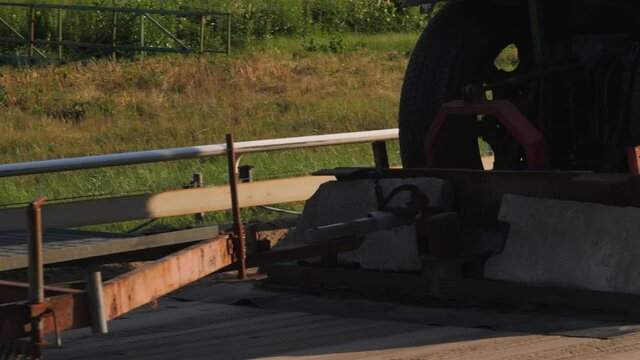 Close view of tractor preparing the greyhound racing track one sunny summer evening in Bor&aring;s, Sweden. 4K footage, slowmotion x2.