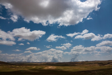 Fototapeta na wymiar Meadow and magnificent clouds