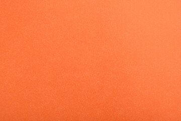 Abstract red glossy paper texture background or backdrop. Empty wrapping paper or shiny paperboard for decorative design element. Grainy surface for Christmas holiday or Chinese new year concept