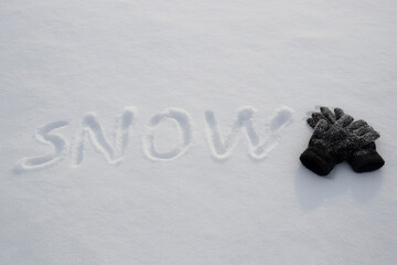 lettering on the snow on a snowy sunny day