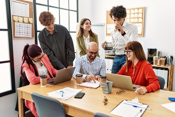Group of business workers smiling happy working at the office.