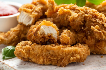 Fried Chicken strips with ketchup on white wooden board. Fast Food