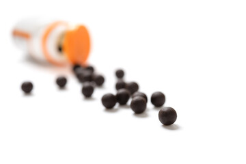 pills and bottle on a white backgrond