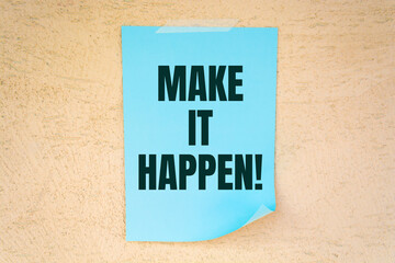 Make it happen! written on color sticker notes over cork board background.