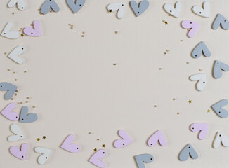 
Hearts background. Valentine's Day decoration. Top view flatlay. Photo for children's party. Design of Greeting Card With 
wooden handmade figurines of hearts. trending pastel colors
