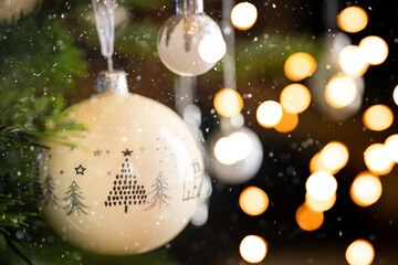 Christmas tree decoration by decorative white balls and blurred christmas lights