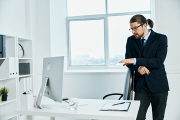 office worker in the office gestures with his hands boss