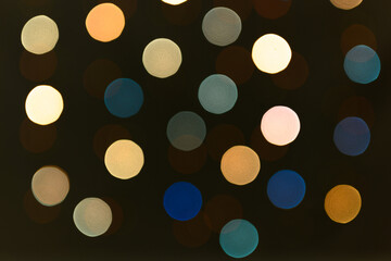 Blurred lights of a garland of cold colors.