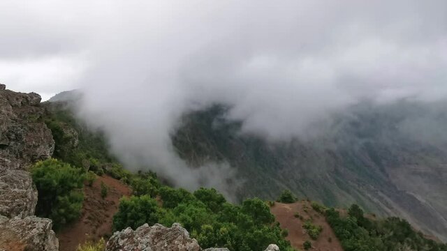 Landscape. Sea of clouds crossing the top of El Hierro island. Canary islands. Spain
