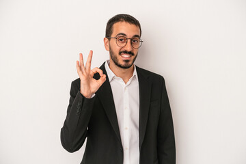 Young caucasian business man isolated on white background cheerful and confident showing ok gesture.
