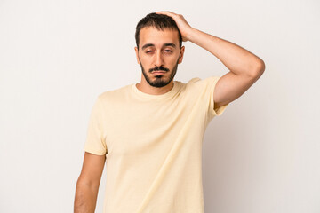 Young caucasian man isolated on white background tired and very sleepy keeping hand on head.
