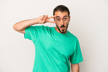 Obraz premium Young caucasian man isolated on white background dancing and having fun.
