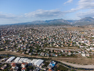 Aerial drone view Tirana, Albania. Buildings, streets and residential houses. A view from above on the roof of the houses in city of Tirana. - obrazy, fototapety, plakaty