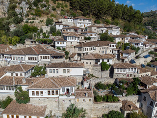 Fototapeta na wymiar Aerial drone view of Berat, Albania. Old town, view from above. City of 1000 windows. Buildings, streets and residential houses.