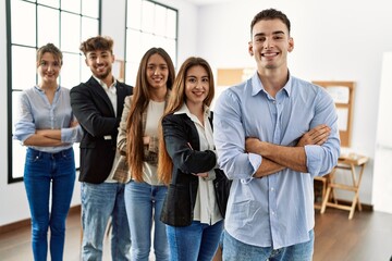 Group of young business workers smiling happy standing with arms crossed gesture at the office.