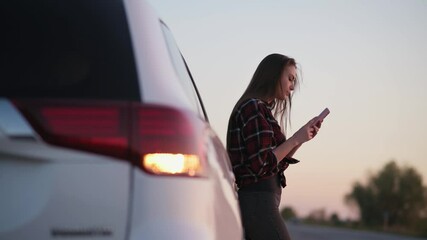 Car breakdown on road. Young upset woman calling car service. Medium shot.