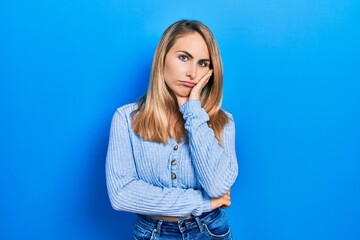 Young caucasian woman wearing casual clothes thinking looking tired and bored with depression problems with crossed arms.