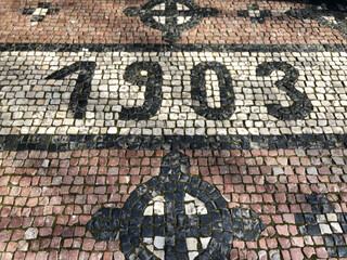 The year 1903 made of cobblestones 