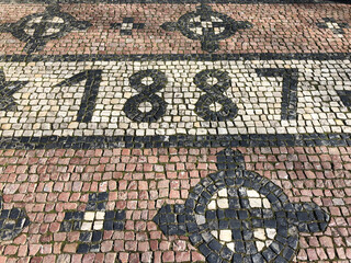 The year 1887 made of cobblestones