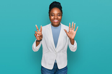 Young african american woman wearing business clothes showing and pointing up with fingers number seven while smiling confident and happy.