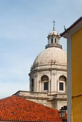 Fototapeta na wymiar Pantheon of Lisbon and red-tiled roofs in a vertical architectural landscape - Lisbon, Portugal