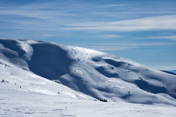 Fototapeta na wymiar Mountain slopes covered with snow.