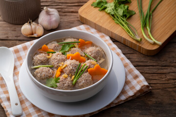 Clear glass noodle soup with Minced Pork and carrot.Asian Meatball Soup with cellophane noodle...