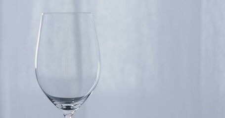 empty wineglass with curtains on background
