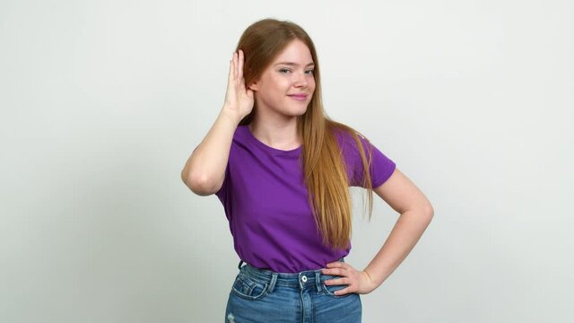 Teenager girl listening something over isolated background