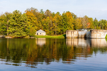 Fototapeta na wymiar The black smith shop at the Jones Falls Locks on the Rideau Canal between Kingston and Ottawa, a heritage water way in Ontario Canada. Shot in October.