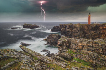 Fototapeta na wymiar Lighthouse during storm weather with lightening, Butt of Lewis,Outer Hebrides, Scotland