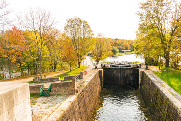 Fototapeta na wymiar The Jones Falls Locks on the Rideau Canal between Kingston and Ottawa, a heritage water way in Ontario Canada. Shot in October.