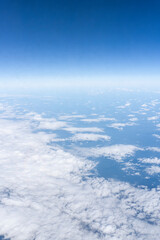 Fototapeta premium beautiful blue sky and clouds, view from the airplane window, horizontal photo