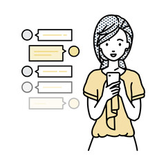 立ってスマートフォンで楽しくチャットで会話するオフィスカジュアルの女性