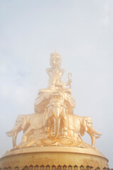 Fototapeta premium gold statue of Samantabhadra Bodhisattva mount emei
