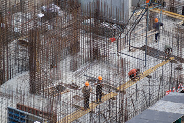 Construction site with cast-in-place reinforced concrete structures. Concreting work at the...