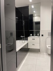 modern black bathroom interior with bath