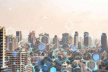 Technology hologram over panorama city view of Bangkok. The largest tech hub in Southeast Asia. The...