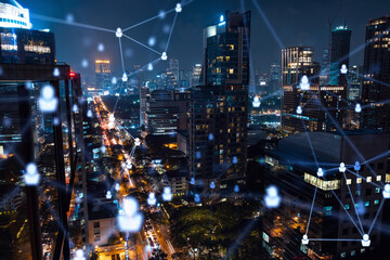 Glowing social media icons on night panoramic city view of Bangkok, Southeast Asia. The concept of networking and establishing new connections between people in businesses. Double exposure.