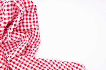 Fabric crumpled with copy space. Tablecloth picnic Red, white texture checkers on white background.