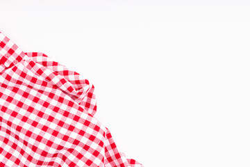 Fabric textile crumpled on white background with copy space. Tablecloth picnic Red, white texture checkers on white background.