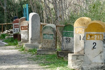 Old milestones exposed on the Bailen-Motril road (N-323) as it passes through La Cerradura de...