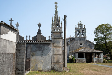 Fototapeta na wymiar LUGO, SPAIN; AUGUST 23, 2021: Small gothic style cemetery next to churches in small town in northern Spain