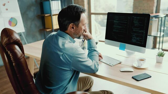 Focused banker accountant read data financial report drink coffee