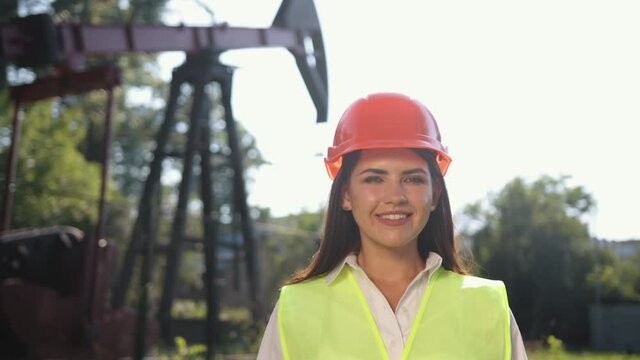 Portrait of female engineer. Female engineer looks directly at camera. Woman
