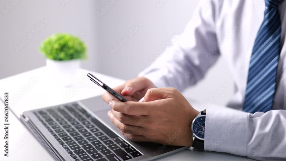 Poster Businessman downloading in mobile store popular applications and multimedia programs. Man hands using a device at a co-working office.