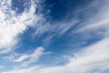 Cirrocumulus and cumulonimbus clouds on an autumn day